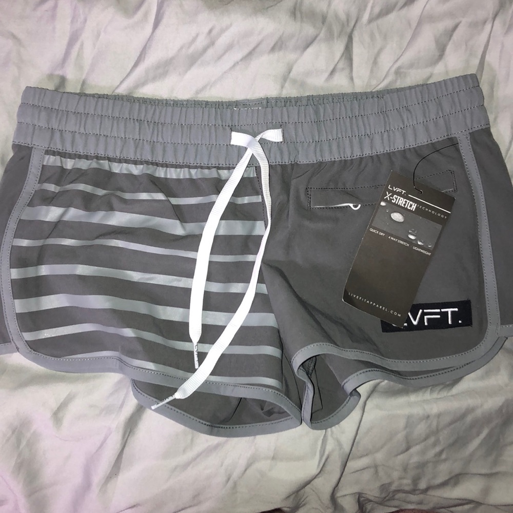 LVFT board shorts, runs small never worn